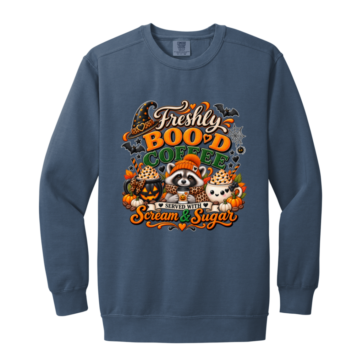Blue Jean Halloween coffee design sweatshirt featuring a cozy raccoon in an orange knit hat and scarf surrounded by pumpkin spice drinks, pumpkins, bats, and autumn leaves, with the text “Freshly Boo'd Coffee” and “Scream & Sugar” on a transparent background