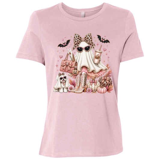 Pink graphic T-shirt with a Halloween illustration of a Glamorous pearl-white ghost fashionista wearing sparkling sunglasses and a leopard-print bow with a dusty-rose handbag, embellished boots, rose-gold pumpkins, black bats, autumn leaves, and a small ghost dog companion on a transparent background