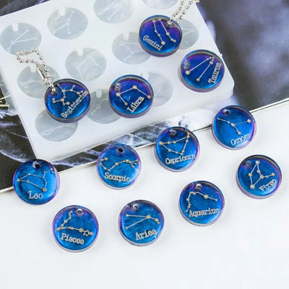 Zodiac-themed using a blue color Resin necklaces plastic mold on a white surface with on a blurred background