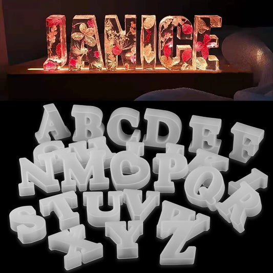 Decorative letters with glowing lights spelling 'JANICE' in epoxy resin with flowers inside each letter and a set of white plastic letters on a black background.