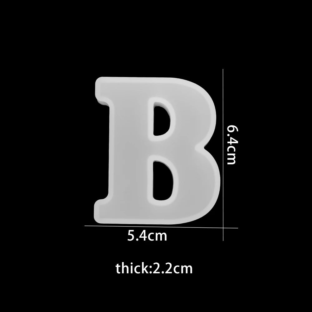 White letter 'B' with measurements on a black background 5.4cm wide, 6.4cm high, 2.2cm thick