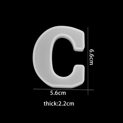 White letter 'C' with dimensions on a black background 5.63cm wide, 6.6cm high, 2.2cm thick