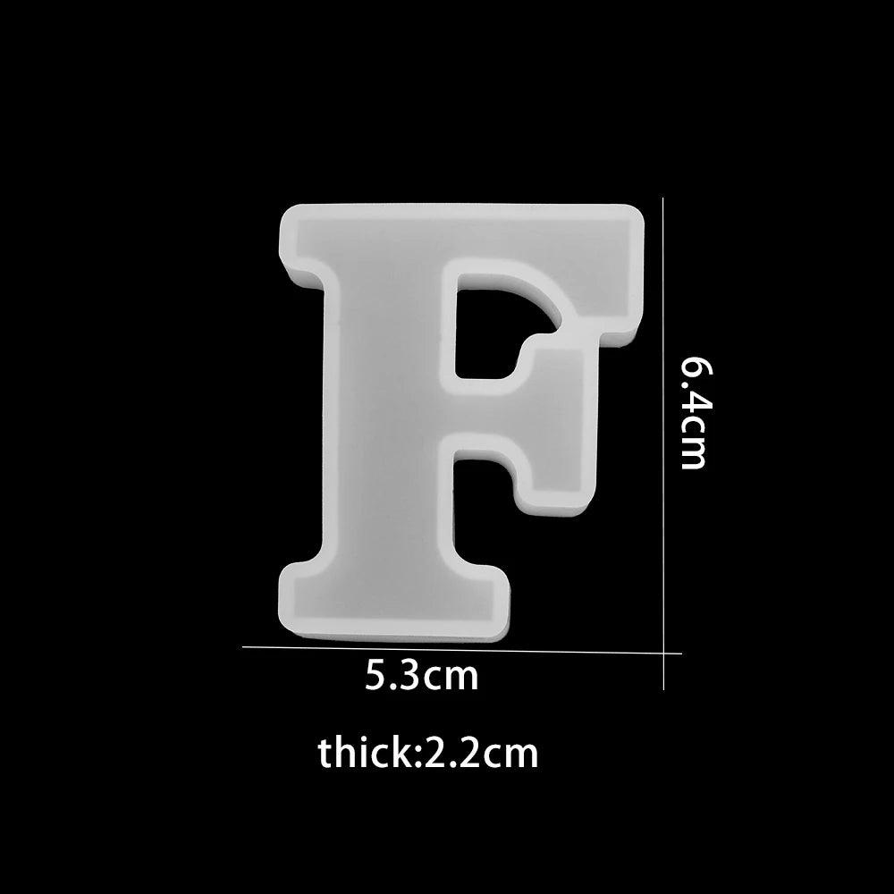 White letter 'F' with dimensions on a black background 5.3cm wide, 6.4cm high, 2.2cm thick