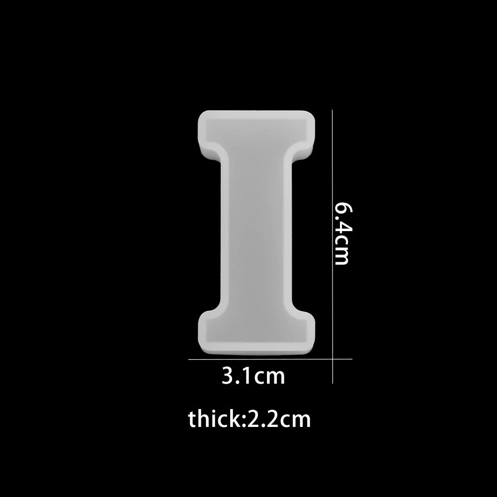 White letter 'I' with dimensions on a black background 3.4 cm wide, 6.4cm high, 2.2cm thick