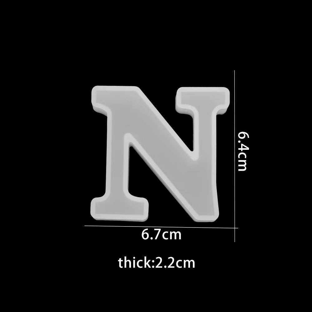 White letter 'N' with dimensions on a black background 6.7cm wide, 6.4cm high, 2.2cm thick