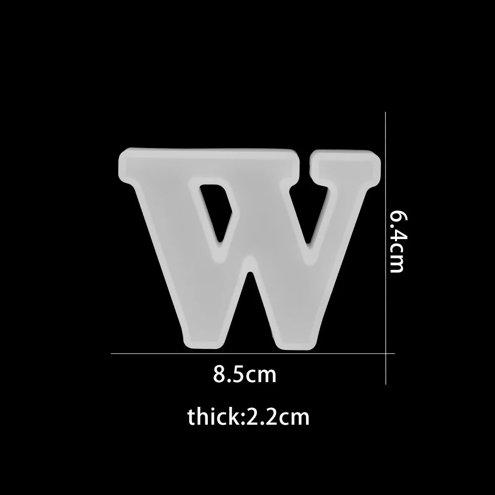 White letter 'W' with dimensions on a black background 8.5cm wide, 6.4cm high, 2.2 cm thick