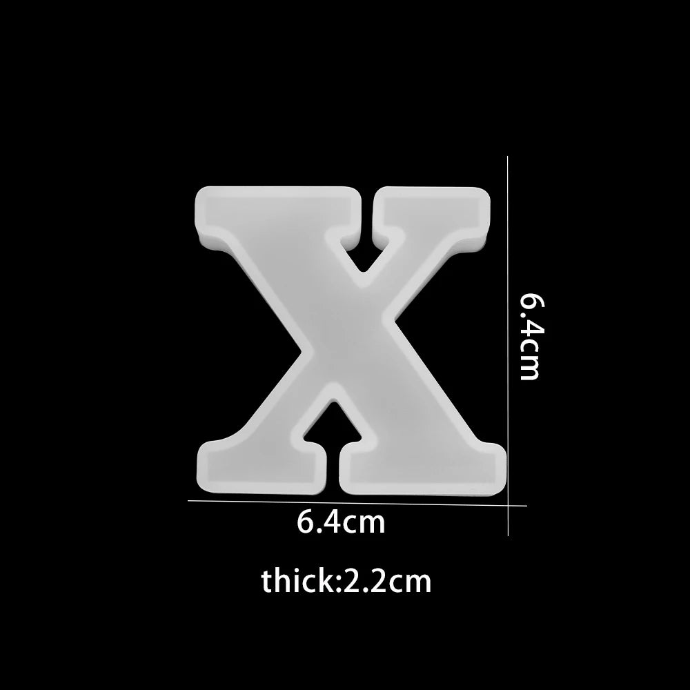 White letter 'X' with measurements on a black background 6.4cm wide, 6.4cm high, 2.2cm thick