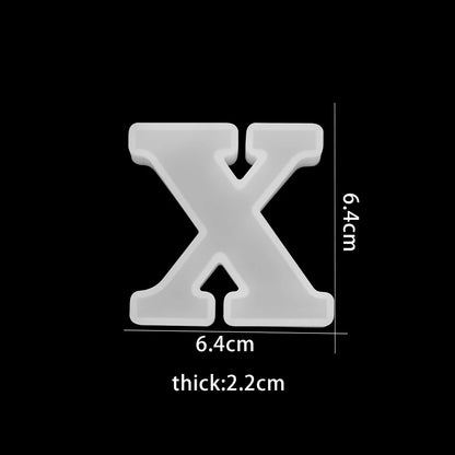White letter 'X' with measurements on a black background 6.4cm wide, 6.4cm high, 2.2cm thick