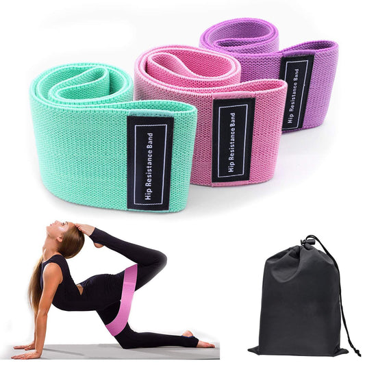 Three colorful fabric resistance loop bands displayed with resistance levels, dimensions, and recommended fitness levels for beginner to advanced workouts with a woman in a yoga pose with a pink band around her legs and a black bag which would hold the bands set on a white background