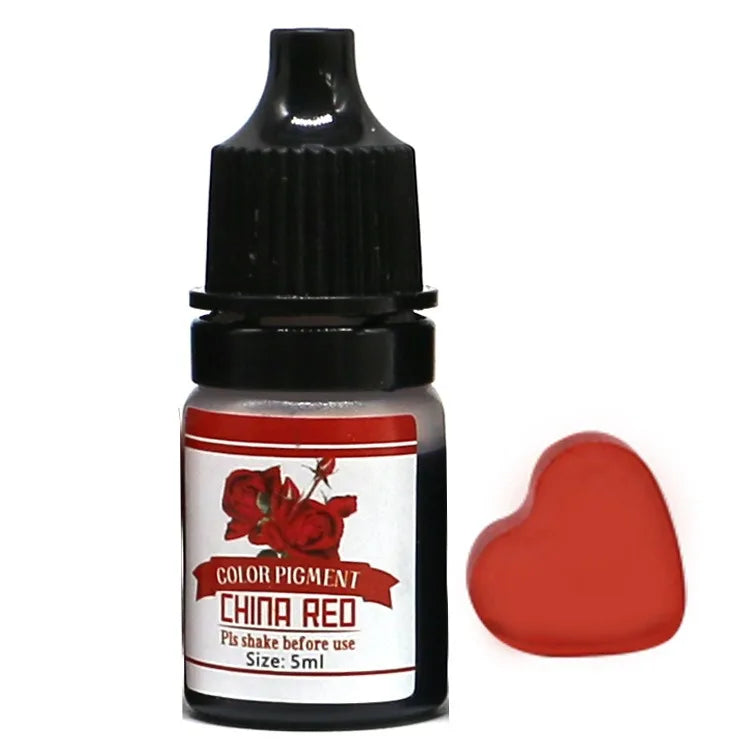 Bottle of color pigment labeled 'China Red' with a heart-shaped sample on a white background