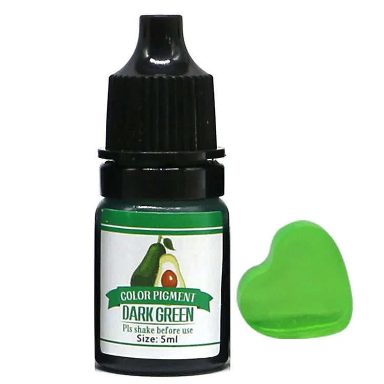 Bottle of dark green color pigment with a green heart-shaped sample on a white background