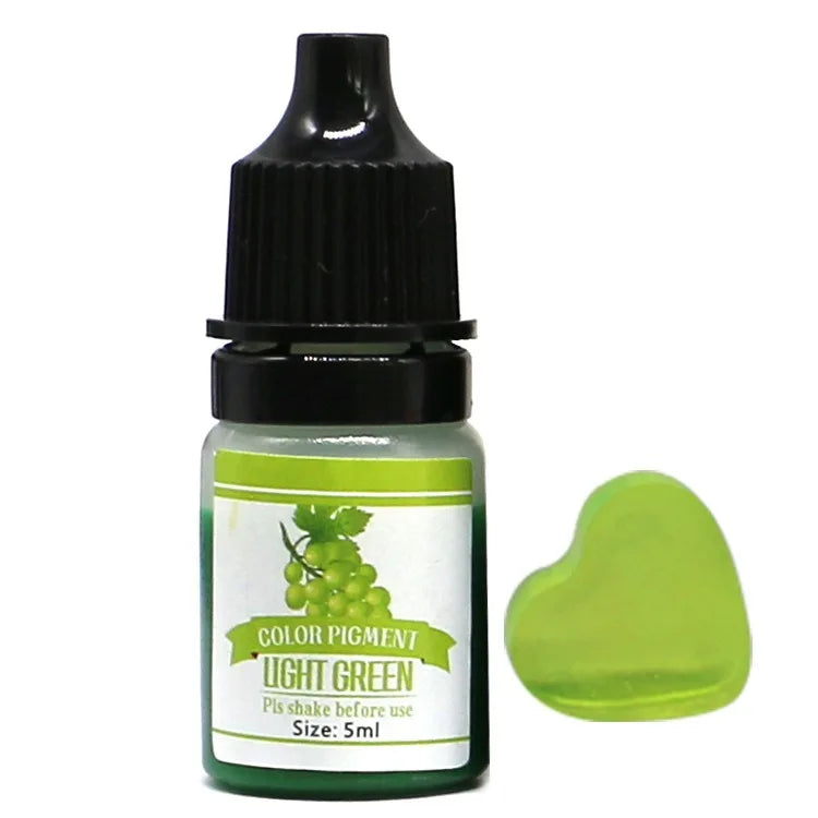 Bottle of light green color pigment with a sample swatch on a white background