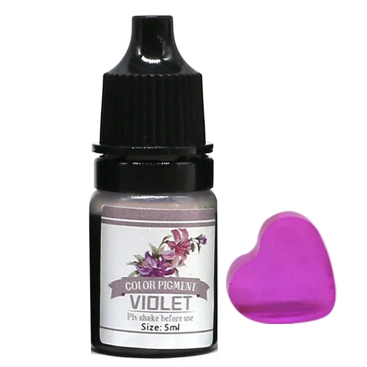 Bottle of Color Pigment Violet with a heart-shaped applicator on a white background