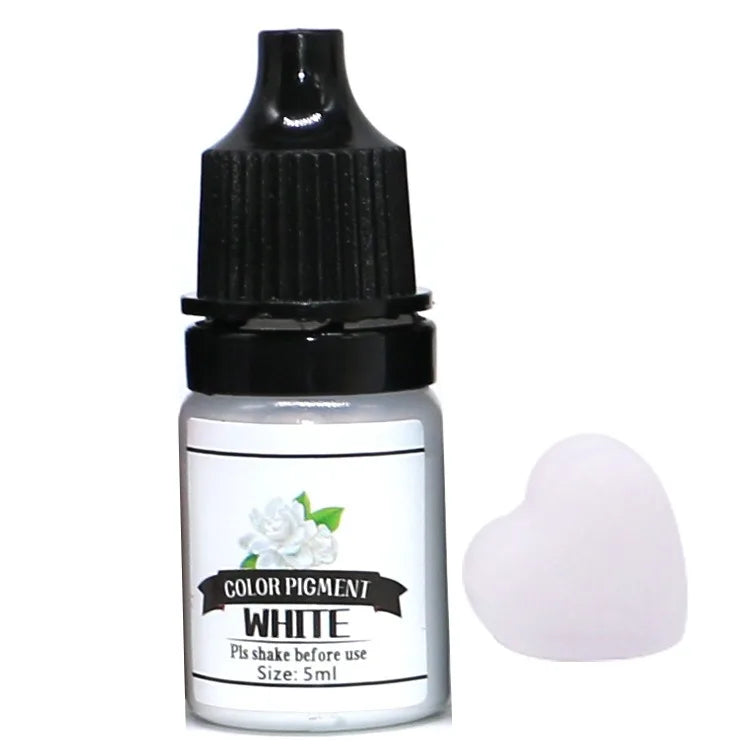 Bottle of white color pigment with a small heart-shaped sample on a white background