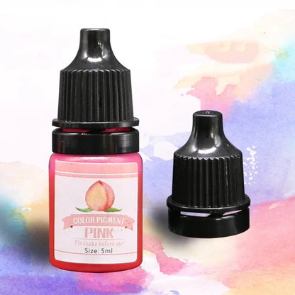 Pink color pigment bottle with black cap on a colorful watercolor background