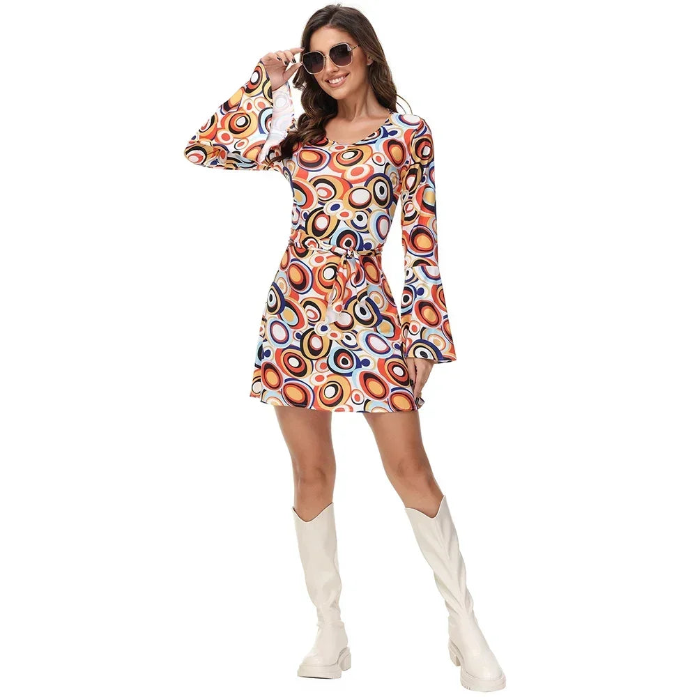 Woman wearing a colorful patterned dress with white knee-high boots on a white background