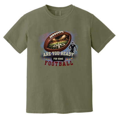 Moss bold football-themed graphic featuring a textured brown football with a glowing nighttime stadium and 50-yard line visible inside, a football player silhouette, watercolor background, and the words “ARE YOU READY FOR SOME FOOTBALL” in cream, black, and burgundy collegiate-style lettering.