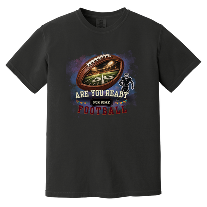 Bold football-themed graphic in Black featuring a textured brown football with a glowing nighttime stadium and 50-yard line visible inside, a football player silhouette, watercolor background, and the words “ARE YOU READY FOR SOME FOOTBALL” in cream, black, and burgundy collegiate-style lettering.