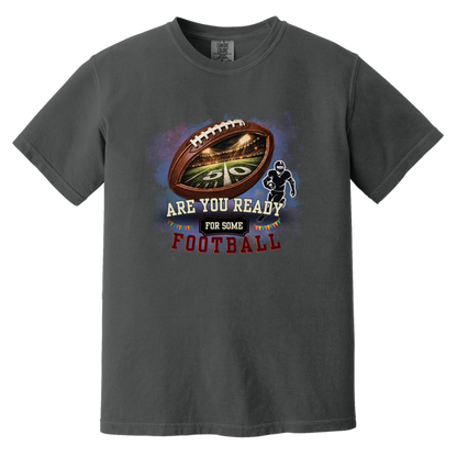 Bold football-themed graphic in Graphite featuring a textured brown football with a glowing nighttime stadium and 50-yard line visible inside, a football player silhouette, watercolor background, and the words “ARE YOU READY FOR SOME FOOTBALL” in cream, black, and burgundy collegiate-style lettering.