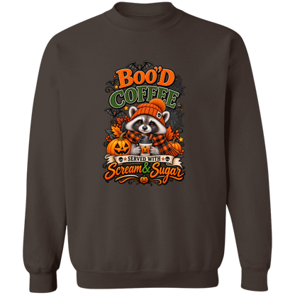 Dark Chocolate Sweatshirt featuring a Halloween raccoon wearing an orange knit hat and black-and-orange plaid scarf while holding a steaming pumpkin coffee, surrounded by pumpkins, autumn leaves, bats, spiderwebs, and berries, with bold text reading “Boo'd Coffee” and “Served With Scream & Sugar” on a transparent background