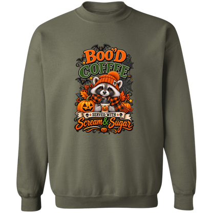 Military Green Sweatshirt featuring a Halloween raccoon wearing an orange knit hat and black-and-orange plaid scarf while holding a steaming pumpkin coffee, surrounded by pumpkins, autumn leaves, bats, spiderwebs, and berries, with bold text reading “Boo'd Coffee” and “Served With Scream & Sugar” on a transparent background