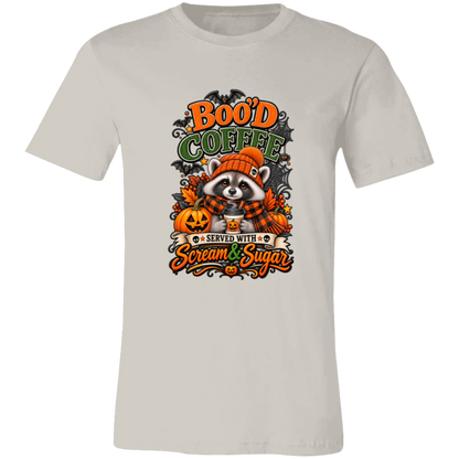Vintage White Unisex T-Shirt featuring a Halloween raccoon wearing an orange knit hat and black-and-orange plaid scarf while holding a steaming pumpkin coffee, surrounded by pumpkins, autumn leaves, bats, spiderwebs, and berries, with bold text reading “Boo'd Coffee” and “Served With Scream & Sugar” on a transparent background