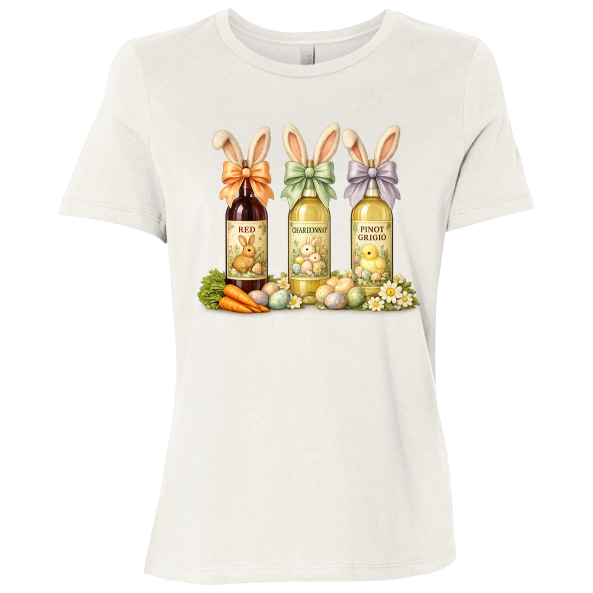 Image of a Vintage White t-shirt with a colorful graphic design of three wine bottles (Red, Chardonnay, Pinot Grigio) with bows around the neck of the bottle and bunny ears posed in different positions at the top, flowers, a bunch of carrots and easter designed eggs are at the bottom surrounding the bottoms.