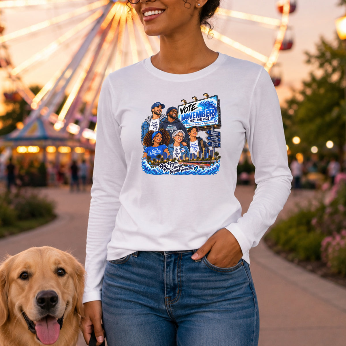 A woman wearing a white long-sleeve graphic t-shirt and blue jeans stands outdoors at an amusement park with a ferris wheel in the background. A golden retriever dog is visible in the lower left corner.