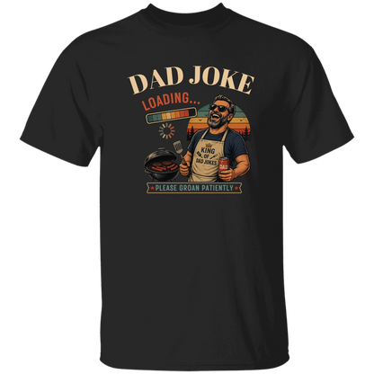 Black t-shirt "Dad Joke, Please Groin Patiently" featuring a retro-inspired grilling dad in sunglasses, a vintage sunset backdrop, and a playful loading bar graphic on a gray and black checkerboard background