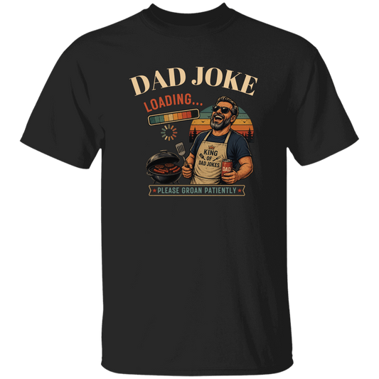 Black t-shirt "Dad Joke, Please Groin Patiently" featuring a retro-inspired grilling dad in sunglasses, a vintage sunset backdrop, and a playful loading bar graphic on a gray and black checkerboard background