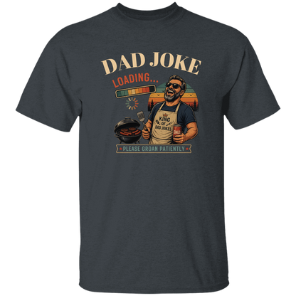 Dark Heather t-shirt "Dad Joke, Please Groin Patiently" featuring a retro-inspired grilling dad in sunglasses, a vintage sunset backdrop, and a playful loading bar graphic on a gray and black checkerboard background