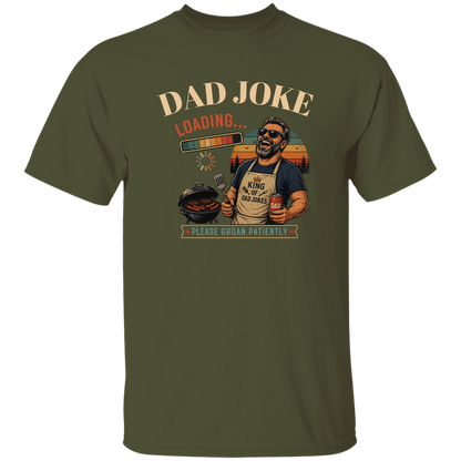 Military Green t-shirt "Dad Joke, Please Groin Patiently" featuring a retro-inspired grilling dad in sunglasses, a vintage sunset backdrop, and a playful loading bar graphic on a gray and black checkerboard background