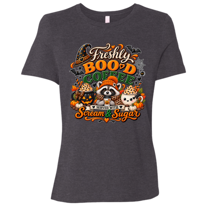 Dark Grey Heather Halloween coffee t-shirt design featuring a cozy raccoon in an orange knit hat and scarf surrounded by pumpkin spice drinks, pumpkins, bats, and autumn leaves, with the text “Freshly Boo'd Coffee” and “Scream & Sugar” on a transparent background