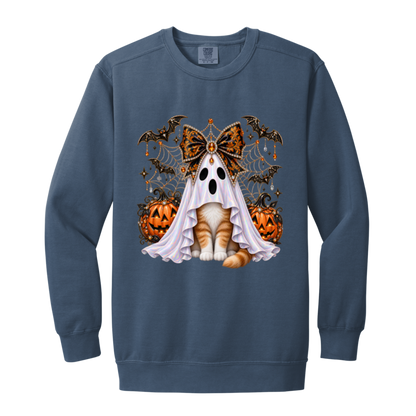 Glam Halloween Blue Jean color sweatshirt cat design featuring an orange-and-white cat wearing an iridescent ghost costume with an ornate black-and-orange jeweled bow, surrounded by decorated jack-o'-lanterns, bats, spiderwebs, stars, and gothic Halloween embellishments on a transparent background.