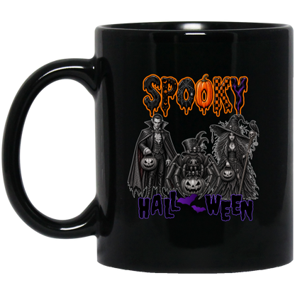 Black 11 oz much featuring a Gothic Halloween design featuring a vampire, witch, and large spider surrounded by jack-o'-lanterns, ravens, skulls, spiderwebs, and gothic details, with bold dripping “SPOOKY” lettering in orange and black at the top and “HALLOWEEN” lettering in purple at the bottom on a transparent background