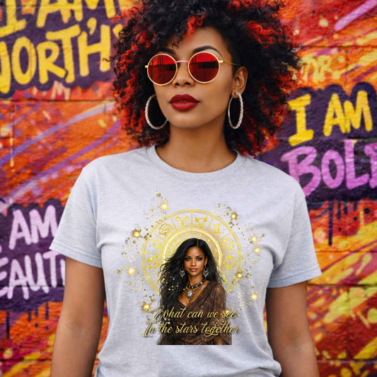 AI Generated woman wearing a grey celestial-inspired t-shirt featuring a radiant zodiac wheel, cosmic gold accents, and the enchanting phrase: 'What can we see in the stars together' standing in front of a colorful mural with different sayings.