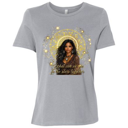 Athletic Grey celestial-inspired t-shirt featuring a radiant zodiac wheel, cosmic gold accents, and the enchanting phrase: 'What can we see in the stars together' standing in front of a colorful mural with different sayings.