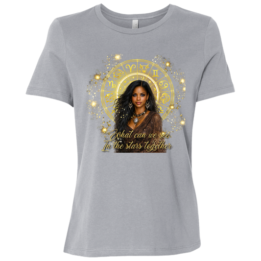 Athletic Grey celestial-inspired t-shirt featuring a radiant zodiac wheel, cosmic gold accents, and the enchanting phrase: 'What can we see in the stars together' standing in front of a colorful mural with different sayings.