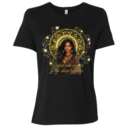Black celestial-inspired t-shirt featuring a radiant zodiac wheel, cosmic gold accents, and the enchanting phrase: 'What can we see in the stars together' standing in front of a colorful mural with different sayings.