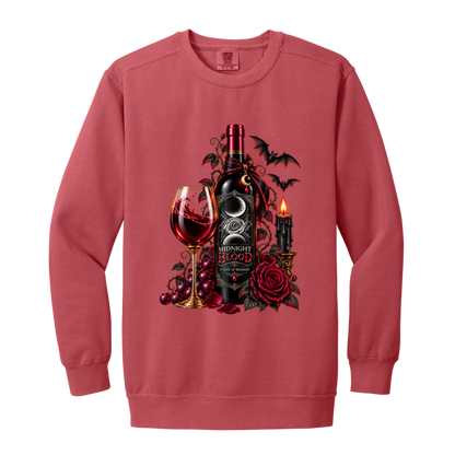 Crimson sweatshirt with a Gothic Halloween wine-inspired design featuring an ornate black bottle labeled “Midnight Blood,” a glass of red wine, crimson roses, dark vines, bats, a crescent moon, glowing black candle, and elegant black, red, gold, and silver details on a transparent background