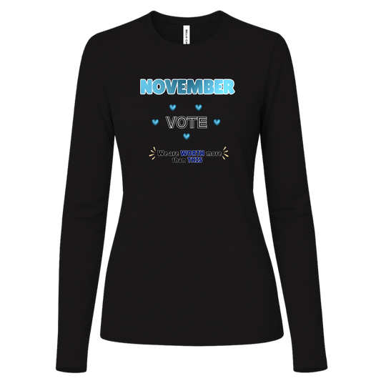 Long Sleeve Black blue and black November voting graphic with bold “NOVEMBER,” outlined “VOTE,” blue hearts, and the message “We are WORTH more than THIS,” accented with warm gold decorative marks on a transparent background.