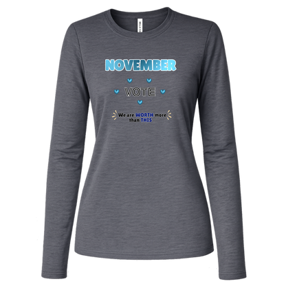 Long Sleeve Deep Heather blue and black November voting graphic with bold “NOVEMBER,” outlined “VOTE,” blue hearts, and the message “We are WORTH more than THIS,” accented with warm gold decorative marks on a transparent background.