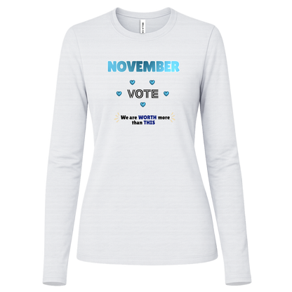 Long Sleeve White blue and black November voting graphic with bold “NOVEMBER,” outlined “VOTE,” blue hearts, and the message “We are WORTH more than THIS,” accented with warm gold decorative marks on a transparent background.