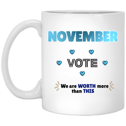 Bold November voting design featuring large blue gradient “NOVEMBER” lettering at the top, surrounded by blue heart accents. The center features outlined “VOTE” text, while the bottom reads “We are WORTH more than THIS,” with WORTH and THIS highlighted in blue and warm gold decorative accents on both sides. The design has a transparent background and high-contrast outlined typography set on a transparent background