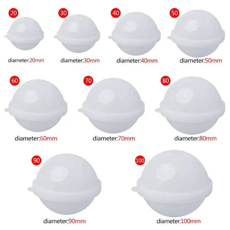 Set of white spherical molds with labeled diameters on a white background
