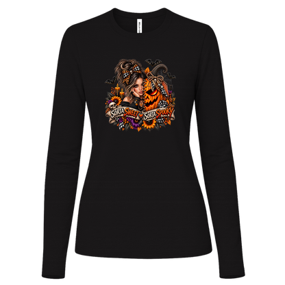 A Black Long Sleeve Shirt featuring a woman in a glamorous Halloween scene surrounded by a decorated jack-o'-lantern, sunflowers, autumn flowers, candles, bats, skulls, and spiderwebs, with a decorative banner reading “Sorta Sweet Sorta Spooky” on a transparent background