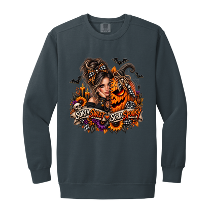 A Denim Sweatshirt featuring a woman in a glamorous Halloween scene surrounded by a decorated jack-o'-lantern, sunflowers, autumn flowers, candles, bats, skulls, and spiderwebs, with a decorative banner reading “Sorta Sweet Sorta Spooky” on a transparent background