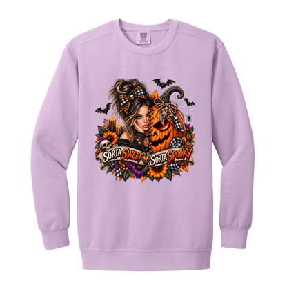 A Orchid Sweatshirt featuring a woman in a glamorous Halloween scene surrounded by a decorated jack-o'-lantern, sunflowers, autumn flowers, candles, bats, skulls, and spiderwebs, with a decorative banner reading “Sorta Sweet Sorta Spooky” on a transparent background