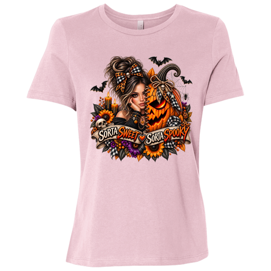 A Pink T-Shirt featuring a woman in a glamorous Halloween scene surrounded by a decorated jack-o'-lantern, sunflowers, autumn flowers, candles, bats, skulls, and spiderwebs, with a decorative banner reading “Sorta Sweet Sorta Spooky” on a transparent background