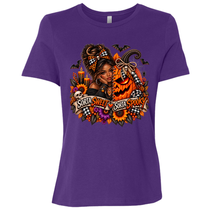 A Purple T-Shirt featuring an African American woman in a glamorous Halloween scene surrounded by a decorated jack-o'-lantern, sunflowers, autumn flowers, candles, bats, skulls, and spiderwebs, with a decorative banner reading “Sorta Sweet Sorta Spooky” on a transparent background